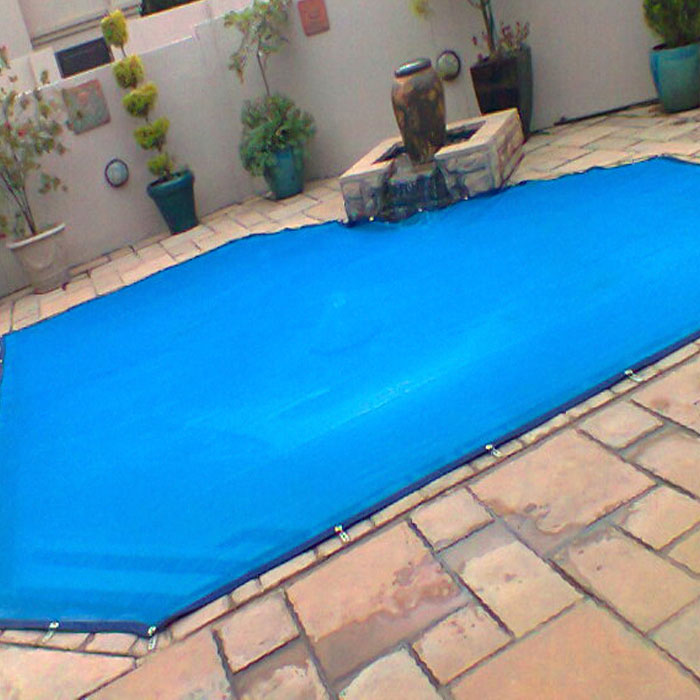 Secure-A-Pool leaf net fitted over a swimming pool