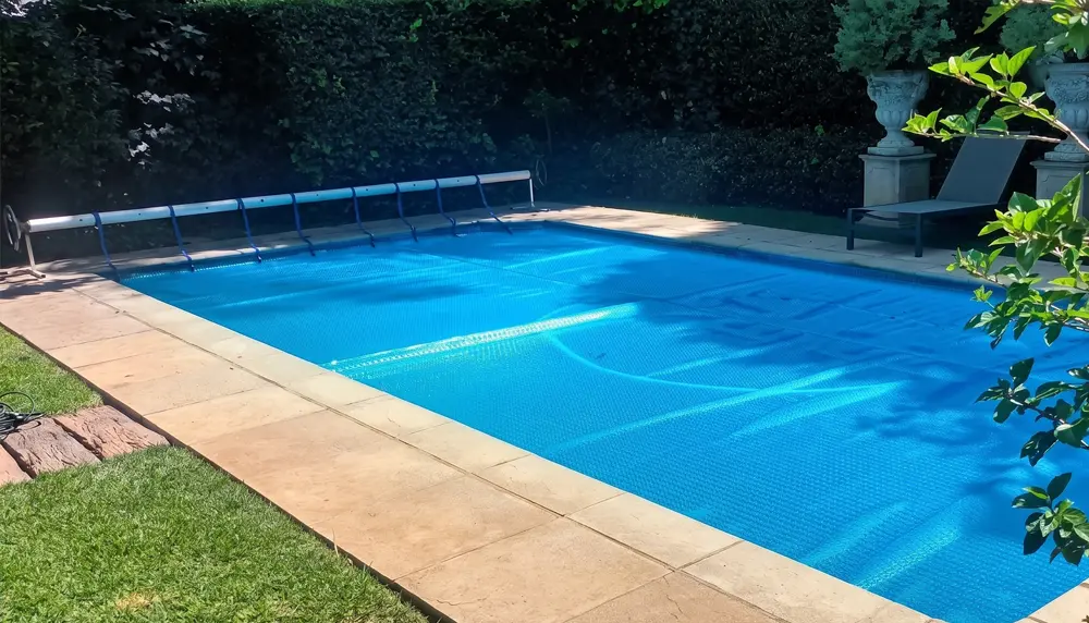 Solar pool cover roll-up station installation